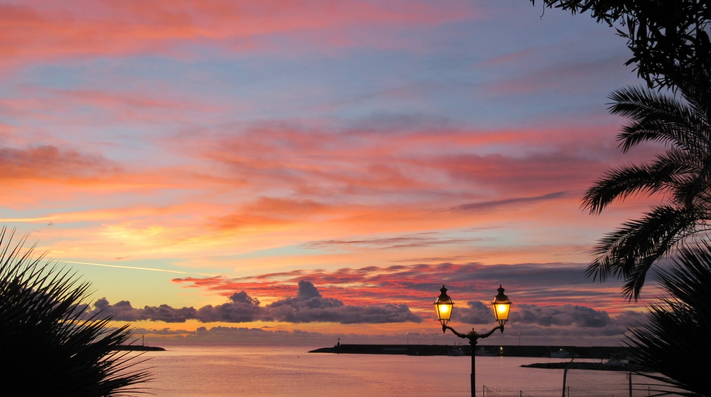 street lamps lit at sunset