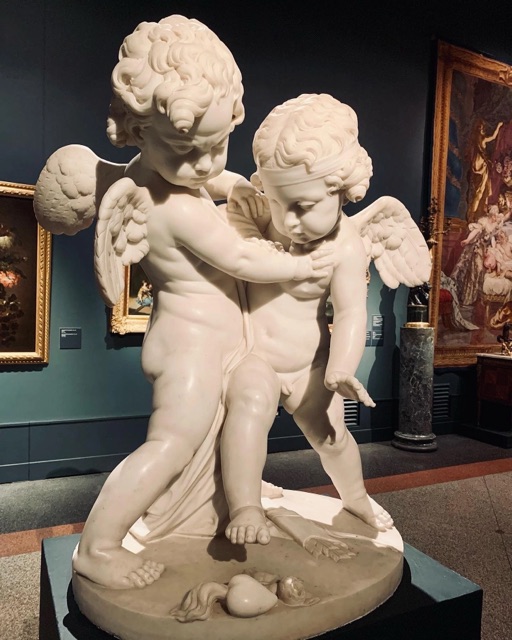 Cupids Fighting for a Human Heart