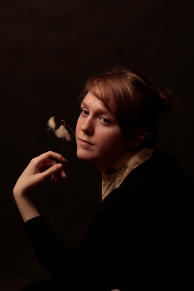 Xenia mit einer Blume