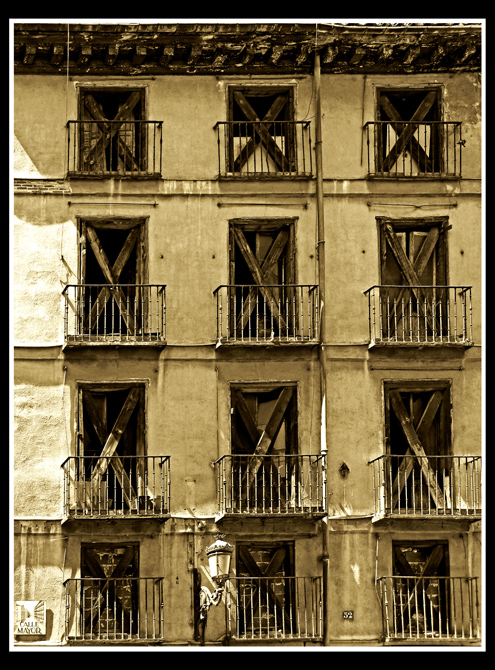 The building with the boarded-up windows