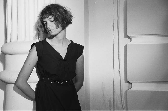 Portrait of a girl against a wall