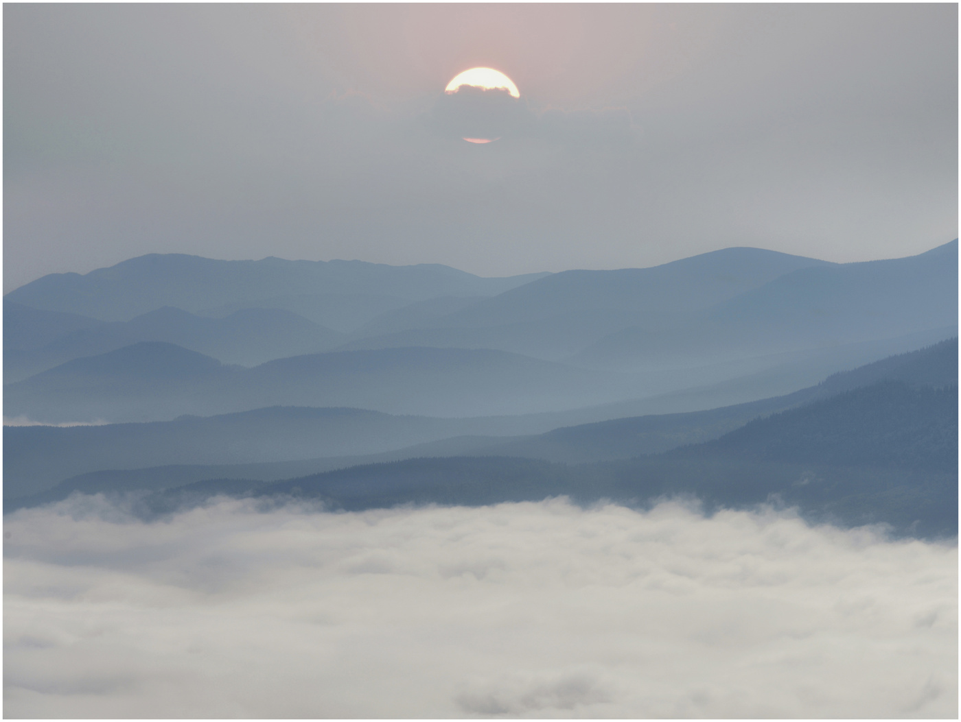 The sea of clouds, mountains and the sun