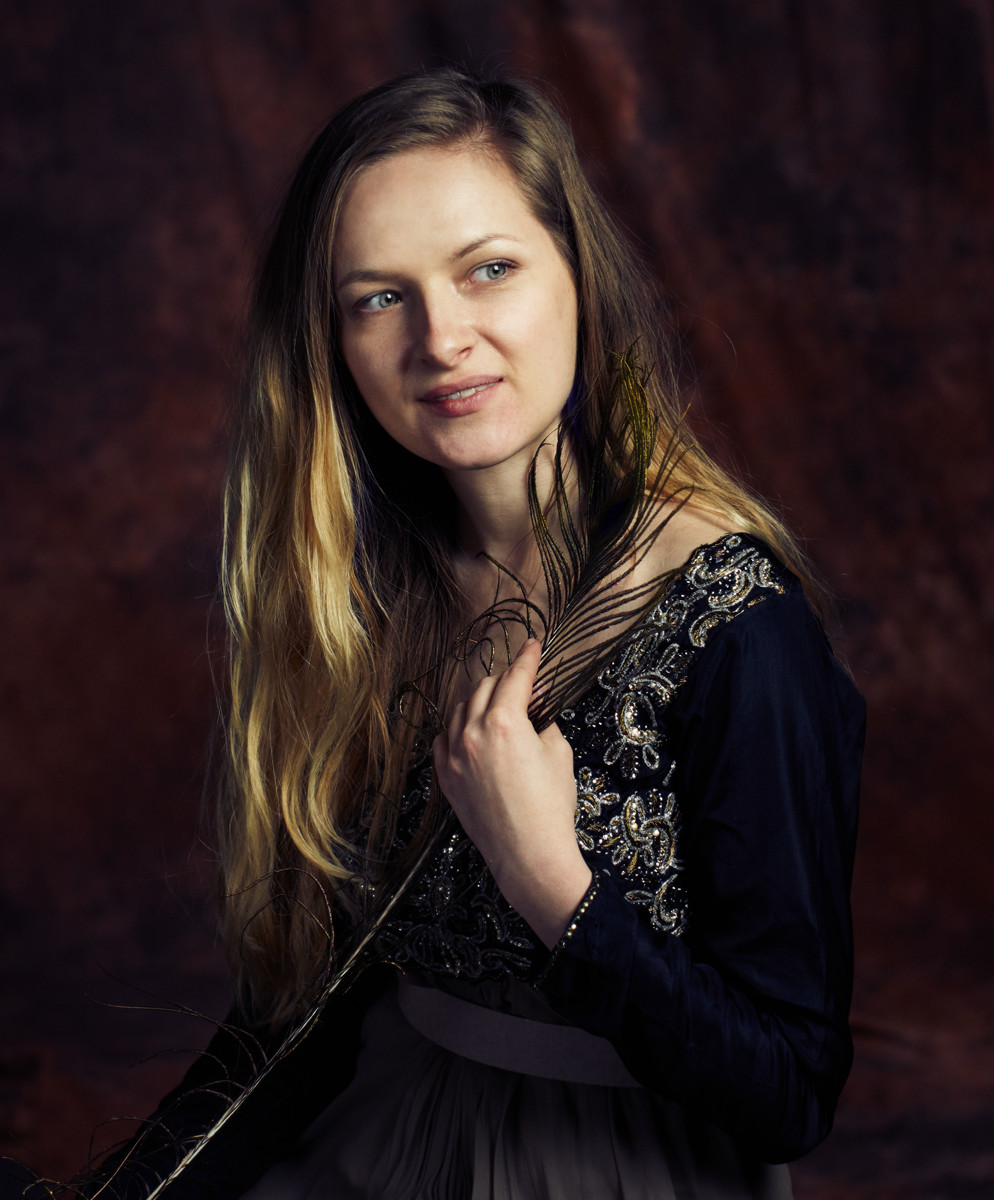 Girl with a peacock feather