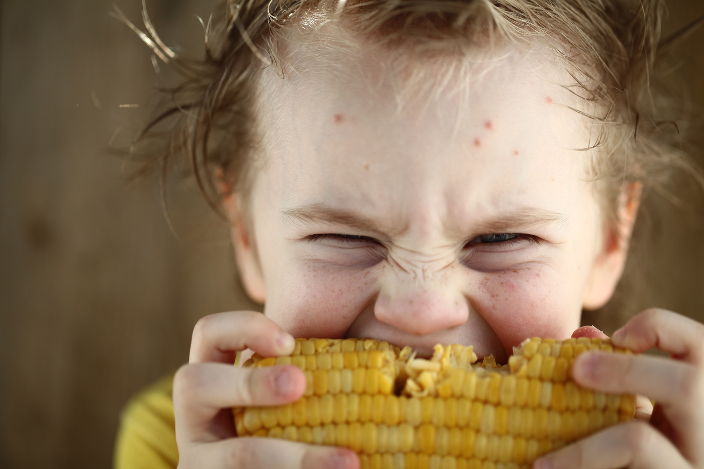 boy eating sweet corn