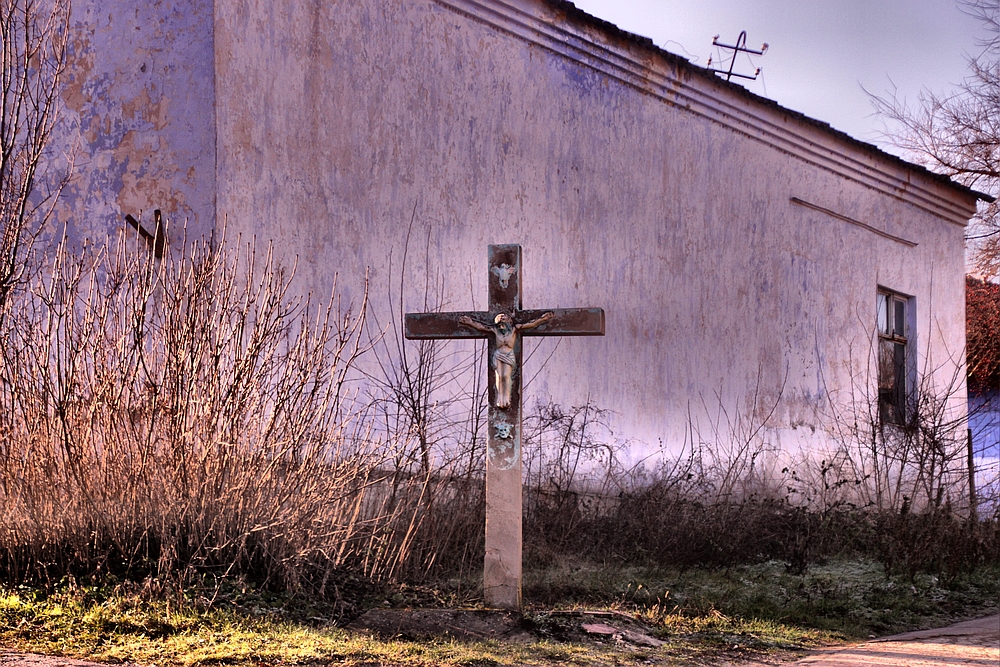 Old house and crucifix